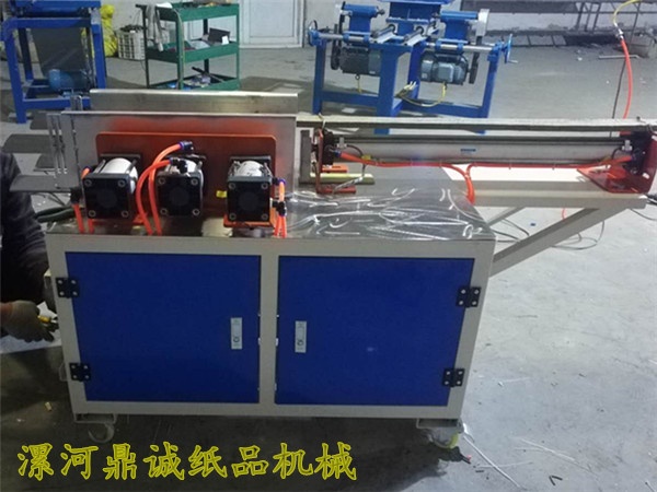 卷紙壓扁裝袋機(jī)